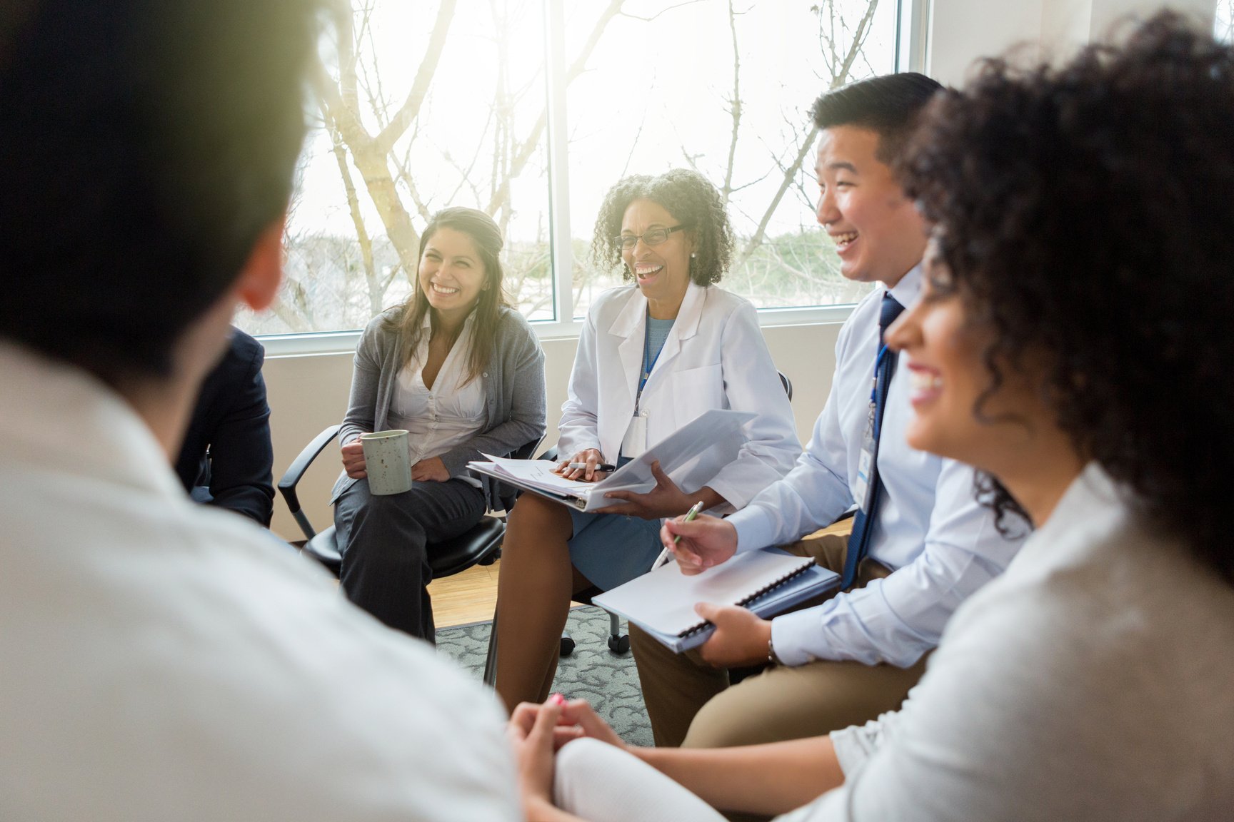 Hospital management meets with healthcare professionals